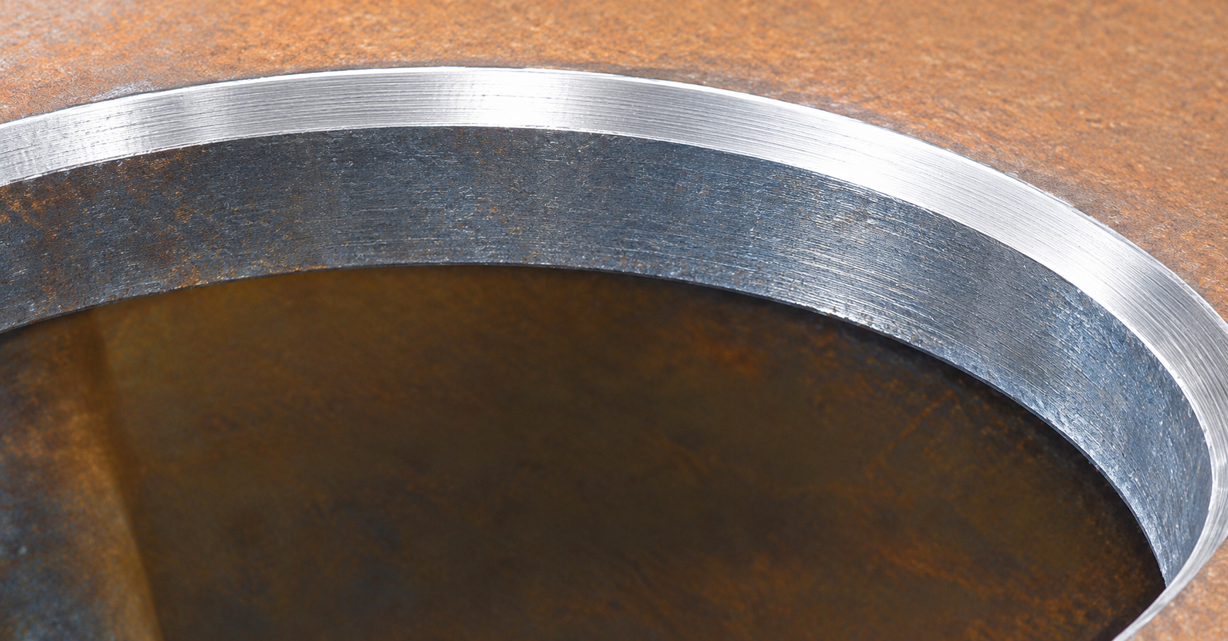 Curved steel opening with machined bevel